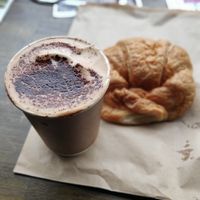 Cappuccino and croissant at The V & V Cafe in Glasgow