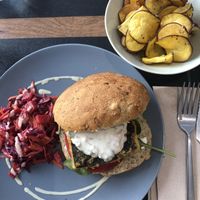 Tofish burger with tartar sauce, sweet potato chips, and sweet & sour salad at Vegan Joe's  in Loule