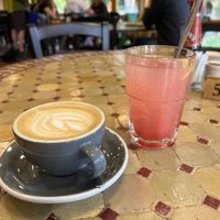 Flat white with oat milk and a homemade pink lemonade  at Caffi Caban Cafe in Brynrefail
