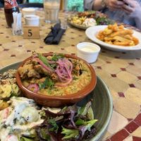 Vegan special of spinach, tomato and coconut dhal with a cavolo nero pakora with a side of three of the special salads and some of caban chips with vegan Mayo  at Caffi Caban Cafe in Brynrefail