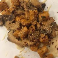 Pumpkin gnocchi with fava bean cream and mushrooms at Cardamomo Cucina Vegana in Arona