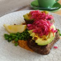 Housemade seeded pumpkin bread, avo, hummus... at KYOsk Cafe in Ocean Grove
