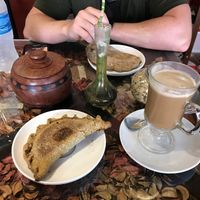 Vegetable empanada and plant based milk coffee   at Cafe Tango in Samaipata