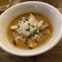 Sweet potato soup with coconut flakes and apples. Tasted very good.  at SIGGIS v/gan dine & co. in Munich