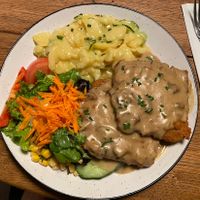 Jägerschnitzel with mushroom sauce and potatoe salad  at SIGGIS v/gan dine & co. in Munich