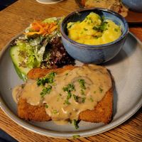 Schnitzel with mushroom sauce and Kartoffelsalat at SIGGIS v/gan dine & co. in Munich