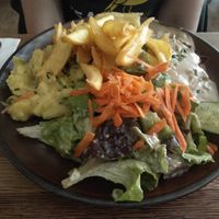 Schnitzel with potato salad and fries. at SIGGIS v/gan dine & co. in Munich