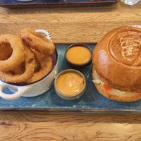 Chicken burger and onion rings at SIGGIS v/gan dine & co. in Munich
