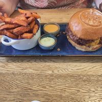 Smashed patty burger and sweet potatoes fries at SIGGIS v/gan dine & co. in Munich