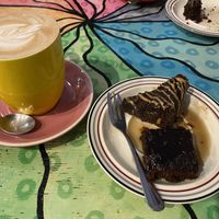 Sharing a peanut butter brownie and sticky date pudding with a decaf almond latte.  at Smith's Alternative Cafe in Canberra