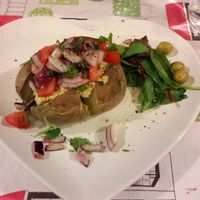 Jacket potato with houmous  at Manchester Vegan Cafe in Manchester