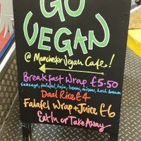 Outdoor sign at Manchester Vegan Cafe in Manchester