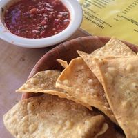 Chips and salsa while we read the menu. Extensive vegan options (well labeled) on simple yellow laminated paper menus. at Hugo's Cocina  in San Diego