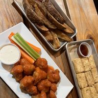 buffalo cauliflower, garlic fries, and tofu nuggets  at Grains  in San Diego