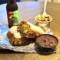 Jorges beef burrito, jalapeño mac and cheese and a side of beans (beer from somewhere else)   at The Vegan Nom - E Cesar Chavez  in Austin