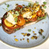 100% vegan - Bruschetta caprese (sourdough toast, pesto, roasted tomatoes, vegan mozzarella, salad, seeds).  at The Therapist - LxFactory in Lisbon