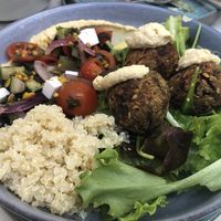 Lentil ball bowl with hummus, Greek salad, quinoa and avocado  at The Therapist - LxFactory in Lisbon