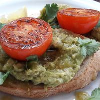 Avocado on sourdough with tomatoes, salsa verde & chilli at Moose Coffee in Manchester