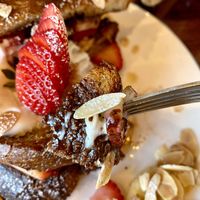 The Nutella type sauce, fruits, cream, toast, and maple syrup of the Stuffed French Toast are yummy   at The Wild Chive in Long Beach