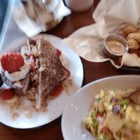 Sorry for the blurry photo; the french toast, country breakfast and tater tots were clear in person. at The Wild Chive in Long Beach
