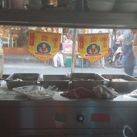 "Kin jay" ("Vegan" in Thai) flags as seen from the table at Pan Road - Vegan Food Cart in Bangkok