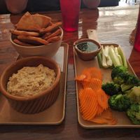 Hummus with pita and veggies. at Roots Pizza in Chicago