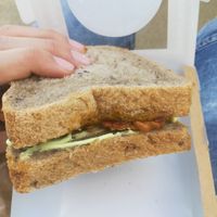 Sandwich con Pesto di Mandorle, Basilico e Pomodori Secchi, Tempeh e Mayo Veg at La Granadilla in Forli