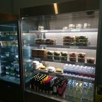 fridge with vegetarian and vegan food items at La Granadilla in Forli