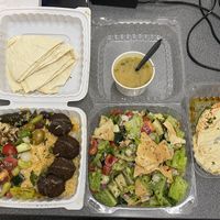 Hummus, falafel platter with a side of lentil soup, and fattoush.  at McBani Authentic Lebanese Cuisine in Seaside