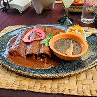 Mushrooms stuffed Red Mole enchiladas.  Delicious! No chicken broth. at Mi Loreto in Loreto