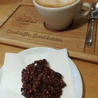 Oatmylk cappuccino and raw vegan chocolate 🍪 at Madal Coffee Co - Ferenciek Tere in Budapest