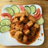 Tofu with tomato sauce and veggies  at Cloudy Sapa Restaurant in Sapa