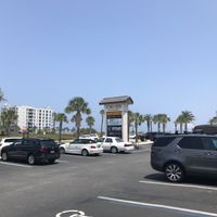 Nice day for an outdoor table with a view of the palms at the beach  at Delicomb in Jacksonville Beach