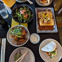 (clockwise from top left) Pumpkin Tofu Bao Bun, Mystery Tofu, another bao bun, gochujang jackfruit dumplings, edamame. at Lucky Chan's Laundry and Noodle Bar in Northbridge