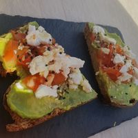 Tostada de aguacate, tomate y queso feta vegano at Roots in Tenerife