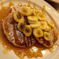 Vegan pancakes with maple syrup and banana. at The Fat Cyclist Cafe in Stirling
