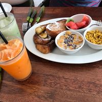 Green tea Latte, Carrot apple juice- Tofu scramble with chick peas and fruit, Banana and toast. All vegan at Around Green - 어라운드 그린 in Seoul