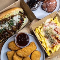Chicken nuggets, pizza fries, funghi and parmesan sandwich and doughnuts at Jake's Vegan Steaks in North London