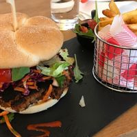 My bean burger which apparently was supposed to look burnt like this. I would not order this meal again, instead a Jackfruit burger or another selection from the menu.  at The Sound Lounge in South West London