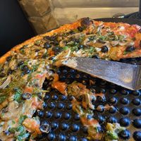 Brier Hill minus dairy cheese added veggies on thin crust. It’s not a pick up kind of pizza. You need a fork and napkins!  at Purola's in Ashtabula