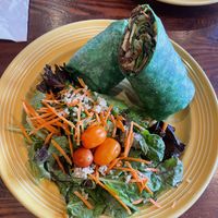 Had the Grill Veggie Wrap and because I don’t eat soy I replaced the tofu with the meat they use on their burgers. It black beans, grains and veggies.  I also added avocado.  at The Grain Cafe in Long Beach