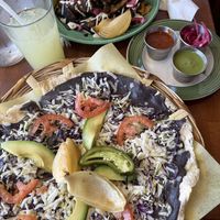 chilaquiles de mole and a tlayuda  at The Grain Cafe in Long Beach
