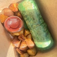 Breakfast burrito with a side of potatoes  at The Grain Cafe in Long Beach