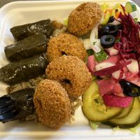 Vegan platter with dolmas, falafel, hummus and salad with pickled veggies and tahini dressing. Yum   at Pita Pockets in Amherst