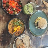 kosmos burger, hummus, tomato salad, brown ice and green ice cream  at Cafe Kosmos in Odense