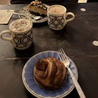 Cinnamon Roll & Snickers cake & Hot chocolate  at Cafe Kosmos in Odense