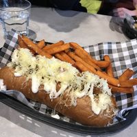 Dachshund hot dog with sweet potato fries at Dogma Cronulla in Cronulla