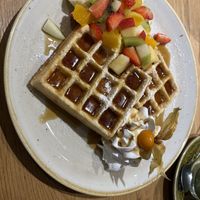 "All-in” waffles with maple syrup. The vegan whip cream was soooo good!  at Green Leaf Cafe in Erding