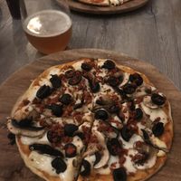 Pizza with mushroom, olives and chorizo  at La Matatena Pizzeria in Oaxaca