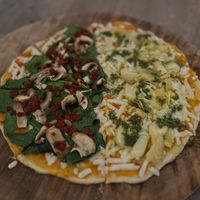 I did a half and a half. One side is spinach, chorizo and mushroom (needed sea salt) Lighter side is artichoke and pesto - not bad. Both had the vegan cheese which is an upcharge.  at La Matatena Pizzeria in Oaxaca
